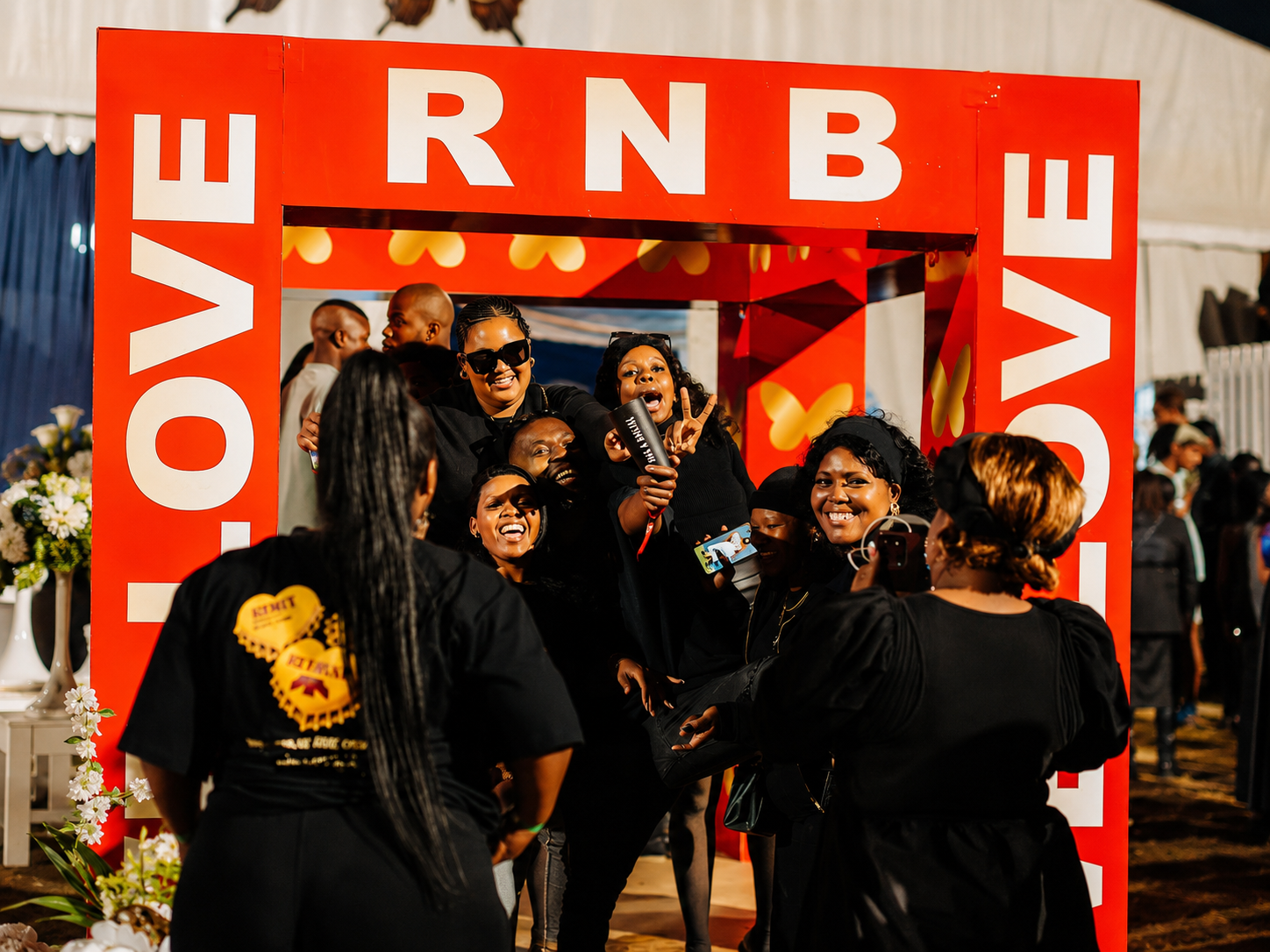 Group of guests posing inside an RNB LOVE photo activation